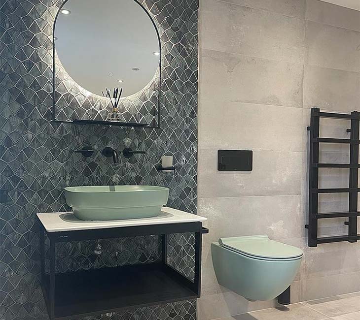 Bathroom showroom display near Dorking with basin mirror and toilet
